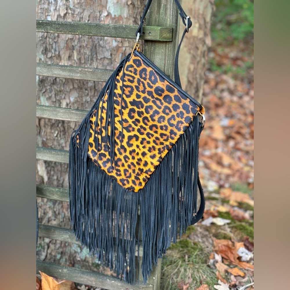 Leopard print with fringe crossbody purse with adj strap 10”x13” leather